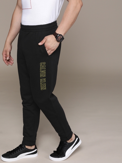 

Calvin Klein Jeans Men Black Solid Slim Fit Joggers With Printed Detail