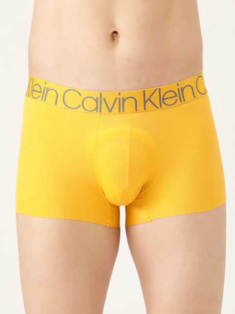 

Calvin Klein Underwear Men Yellow Solid Trunk NB1906TR7-Summer Shine W/ Gray Logo