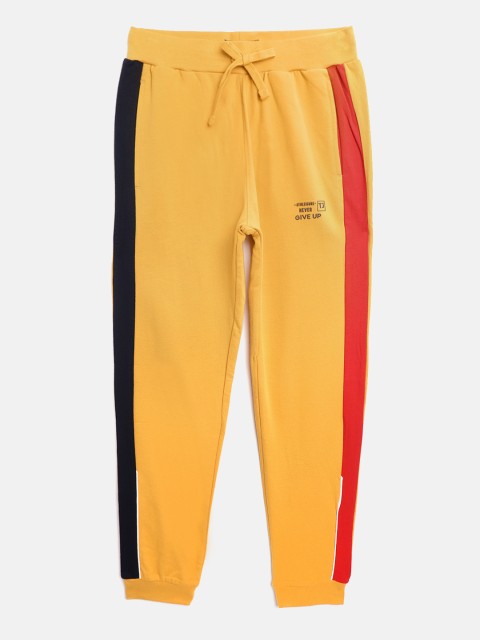 

Indian Terrain Boys Mustard Yellow Solid Cotton Joggers with Side Taping Detail