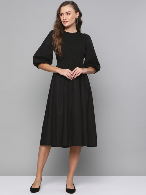 

Femella Women Black Solid Fit and Flare Dress