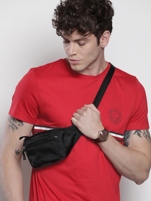 

Tommy Hilfiger Men Red Solid Round Neck T-shirt With Printed Detailing