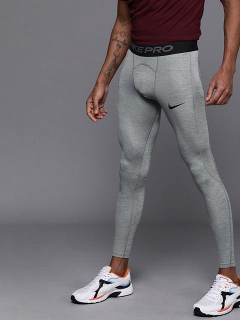 

Nike Men Grey Melange Tight Fit Solid Dri-Fit AS M NP Training Tights