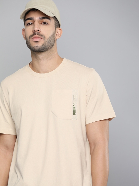 

Puma Men Beige Solid Pure Cotton T-shirt
