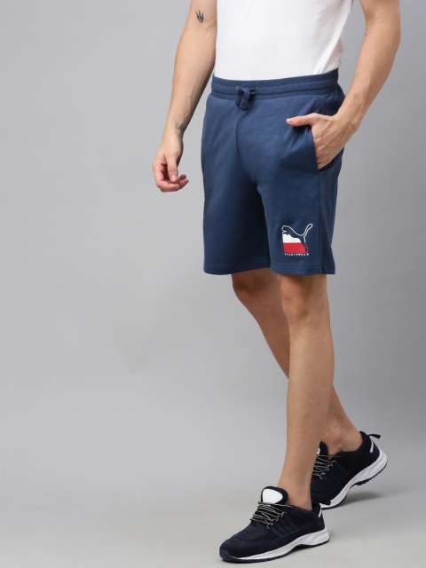 

Puma Men Navy Blue Solid Regular Fit ATHLETICS Sports Shorts with Printed Detail