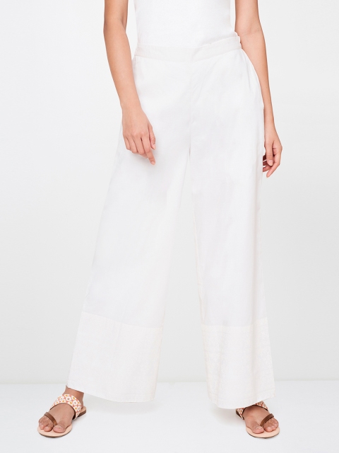 

Global Desi Women White Solid Wide Leg Palazzos with Printed Detailed Hem