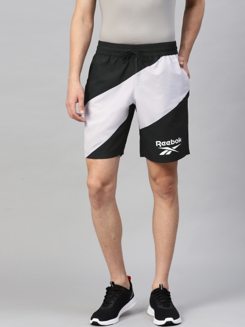 

Reebok Men Black & Off-White WOR Woven Graphic Colourblocked Training Shorts
