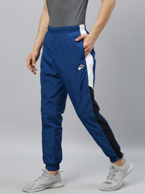 

Nike Men Navy Blue Solid Regular Fit Windrunner AS M NSW HE WR PANT WVN Dri-Fit Joggers