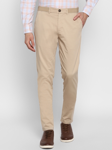 

Red Tape Men Beige Tapered Fit Solid Regular Trousers