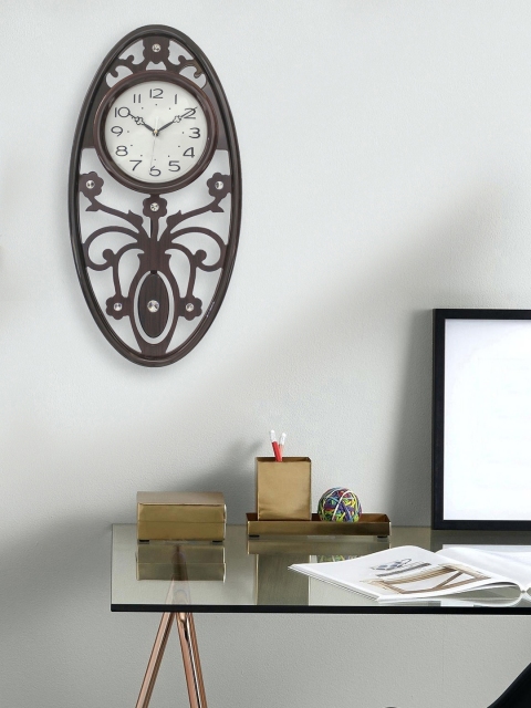 

eCraftIndia White Oval Solid 25cm Analogue Wall Clock