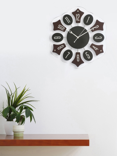 

eCraftIndia Black Floral Solid Analogue Wall Clock