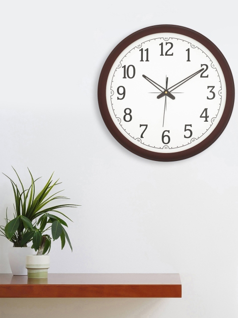 

eCraftIndia White Round Solid Analogue Wall Clock