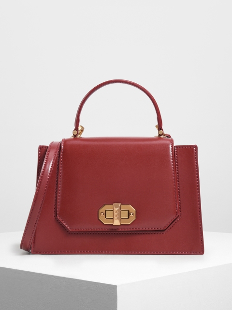 

CHARLES & KEITH Red Solid Handheld Bag