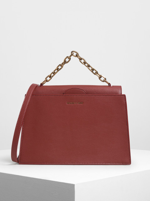

CHARLES & KEITH Red Solid Handheld Bag