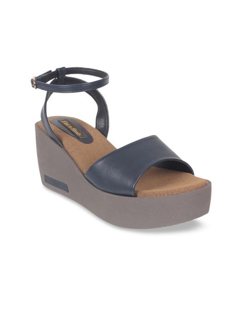 

Flat n Heels Women Blue Solid Wedge Heels