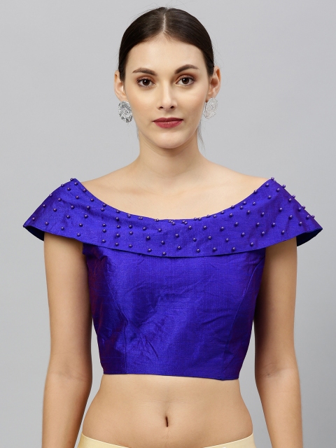 

Amrutam Fab Women Blue Solid Boat Neck Blouse with Embellishments