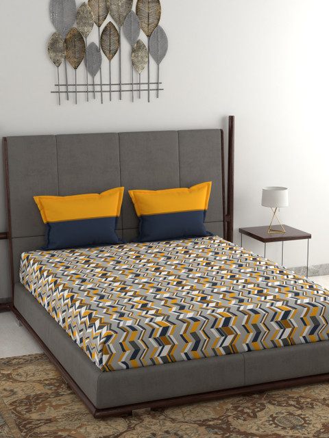 

Trident Yellow & Black Geometric 120 TC Cotton 1 Queen Bedsheet with 2 Pillow Covers