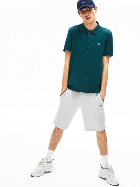 

Lacoste Men Teal Blue Solid Polo Collar T-shirt