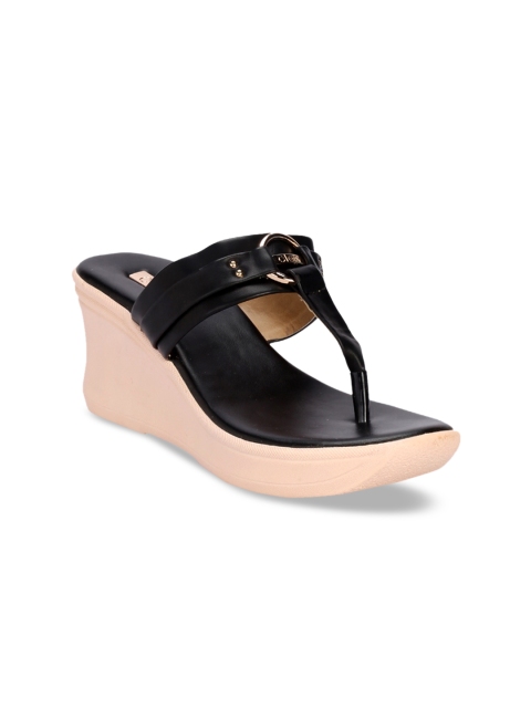 

Khadims Women Black Solid Wedges