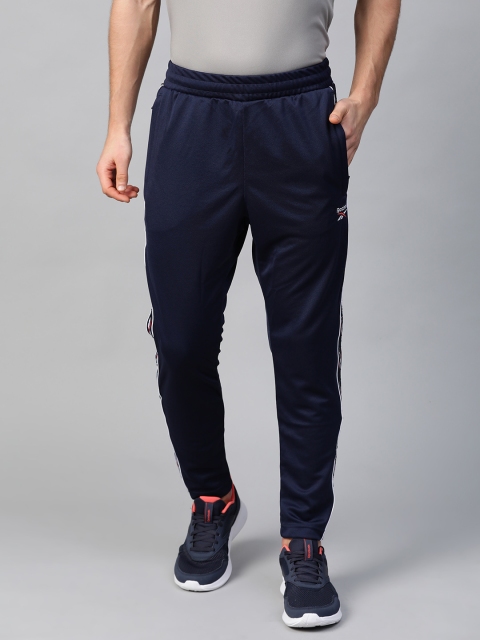

Reebok Classic Men Navy Blue F Vector Tape Solid Track Pants