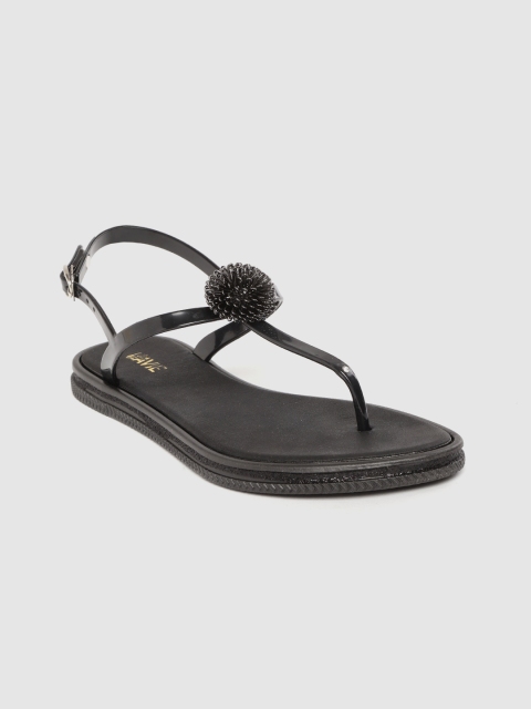 

Lavie Women Black Solid Plastic T-Strap Flats with Floral Detail