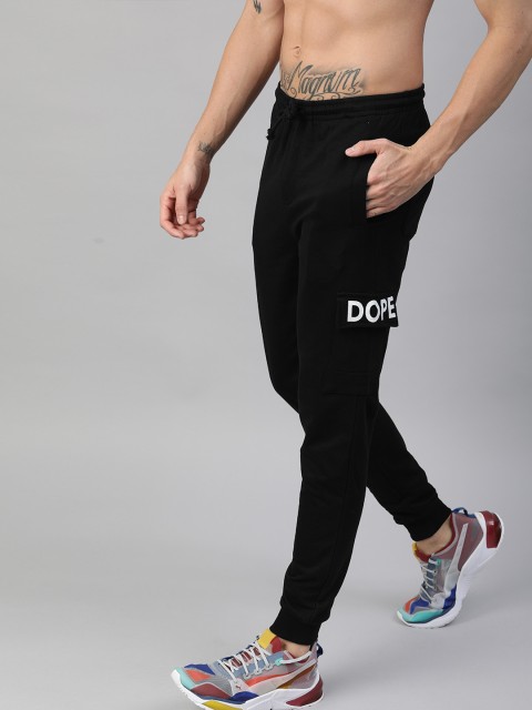 

Kook N Keech Men Black Solid Joggers with Printed Detail