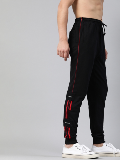

Kook N Keech Men Black Solid Track Pants with Side Stripes