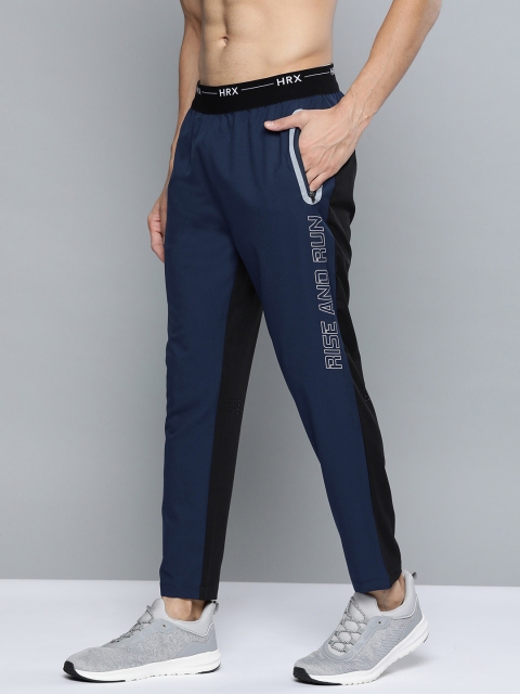 

HRX by Hrithik Roshan Medieval Blue Solid Slim fit Antimicrobial Lycra Running Track Pants, Navy blue