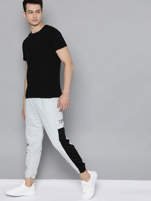 

HRX by Hrithik Roshan Men Gery Violet Colourblock Regular Fit Rapid-Dry Lifestyle Jogger, Grey