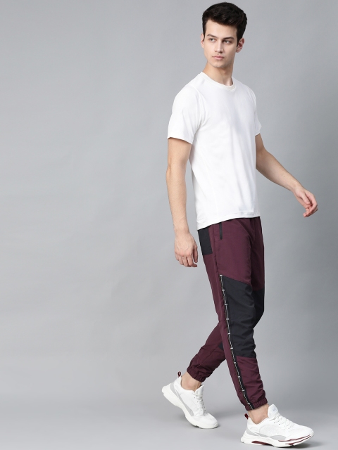 

HRX by Hrithik Roshan Men Fig & Jet Black Colourblock Regular Fit Antimicrobial Lifestyle Track Pants, Maroon