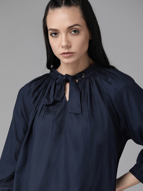 

Roadster Greenturn Women Navy Blue Solid Sustainable Top With Tie-Up Neck
