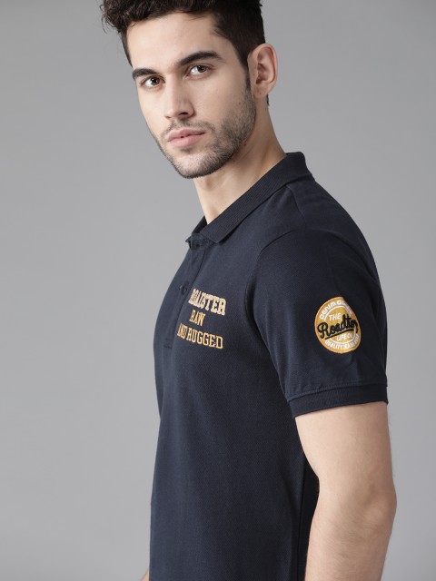 

Roadster Men Navy Blue Solid Polo Collar T-shirt with Applique Detail