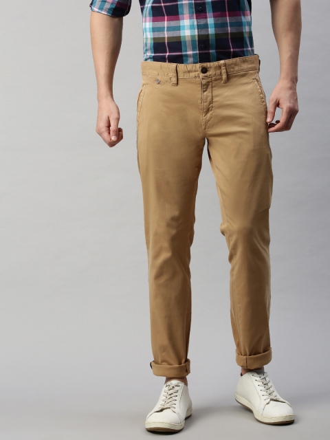 

Tommy Hilfiger Men Beige Solid Slim Fit Chinos