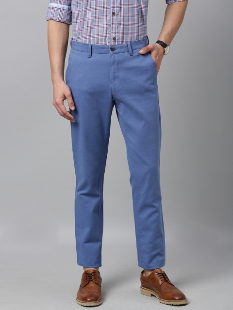 

Van Heusen Sport Men Blue Tapered Fit Solid Cropped Regular Trousers