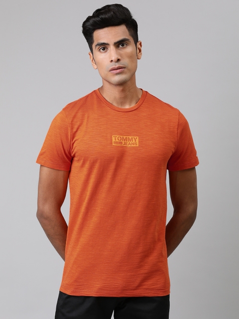 

Tommy Hilfiger Men Orange Slim Fit Solid Round Neck Pure Cotton T-shirt with Printed Detail