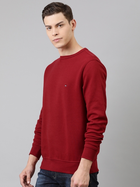 

Tommy Hilfiger Men Red Solid Sweatshirt