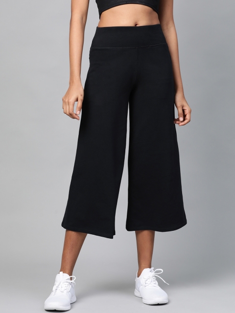 

Marks & Spencer Women Black Solid Flared 3/4th Track Pants