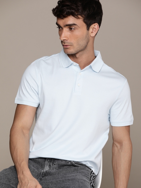 

Calvin Klein Jeans Men Blue Solid Polo Collar Pure Cotton T-shirt