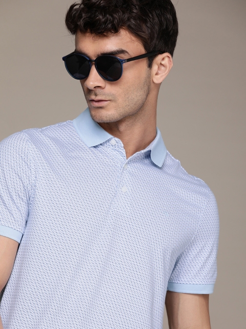 

Calvin Klein Jeans Men Blue Solid Polo Collar T-shirt