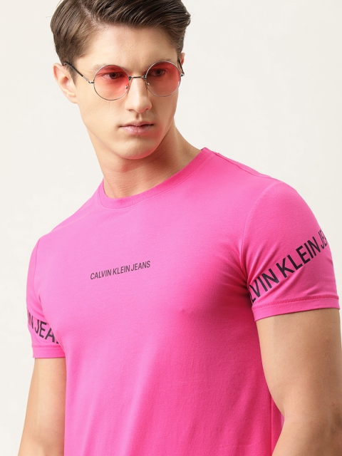 

Calvin Klein Jeans Men Pink Solid Round Neck T-shirt With Printed Detailing