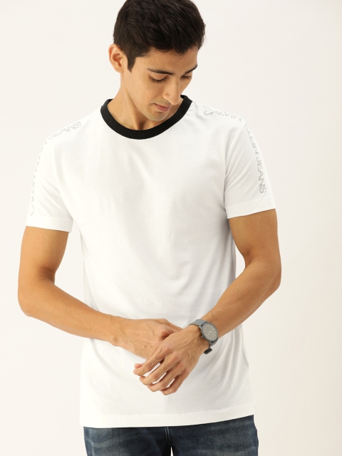 

Calvin Klein Jeans Men White Solid Round Neck T-shirt with Print