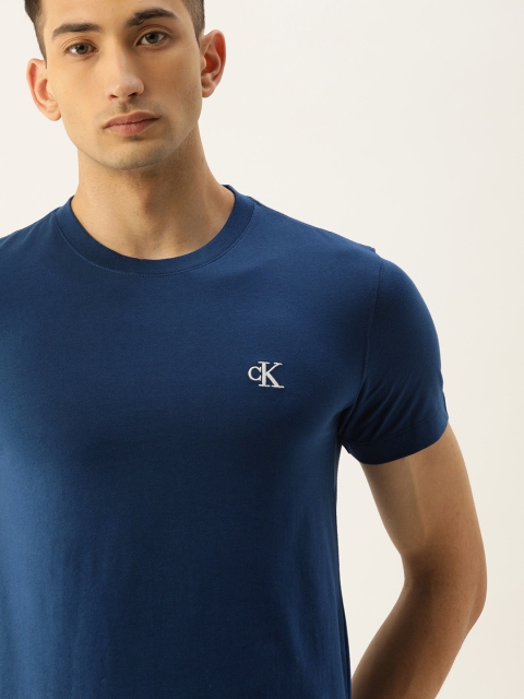 

Calvin Klein Jeans Men Blue Solid Round Neck T-shirt