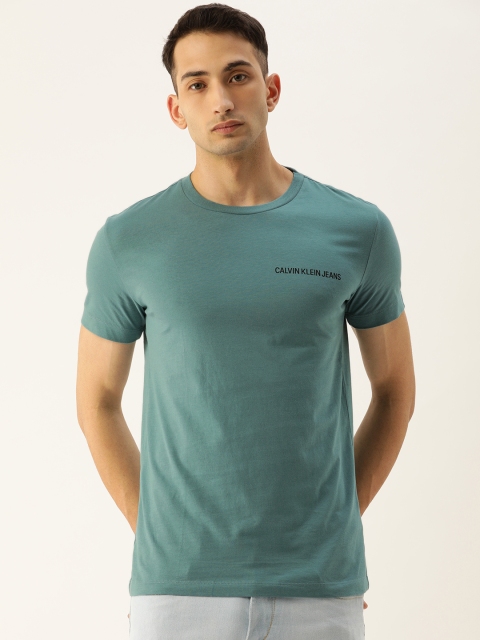 

Calvin Klein Jeans Men Green Solid Round Neck T-shirt