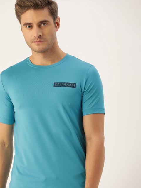 

Calvin Klein Jeans Men Blue Solid Round Neck T-shirt