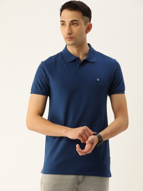 

Calvin Klein Jeans Men Blue Solid Round Neck T-shirt