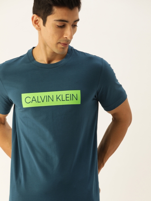 

Calvin Klein Jeans Men Blue Solid Round Neck T-shirt
