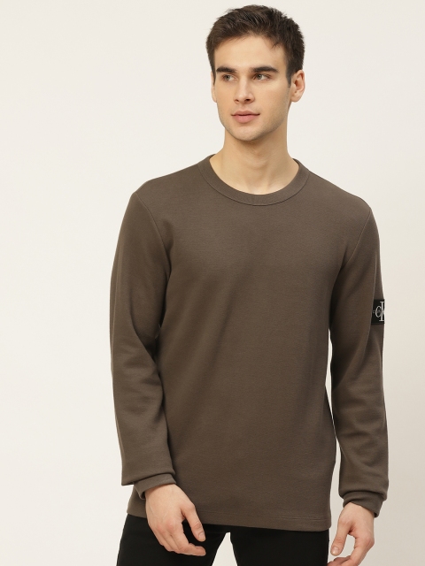 

Calvin Klein Jeans Men Olive Brown Solid Round Neck T-shirt