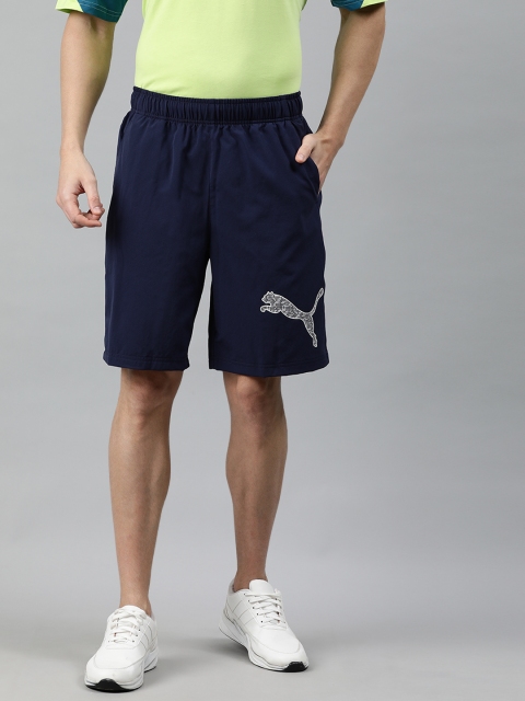 

Puma Men Navy Blue Solid Regular Fit RTG Woven 9" Sports Shorts