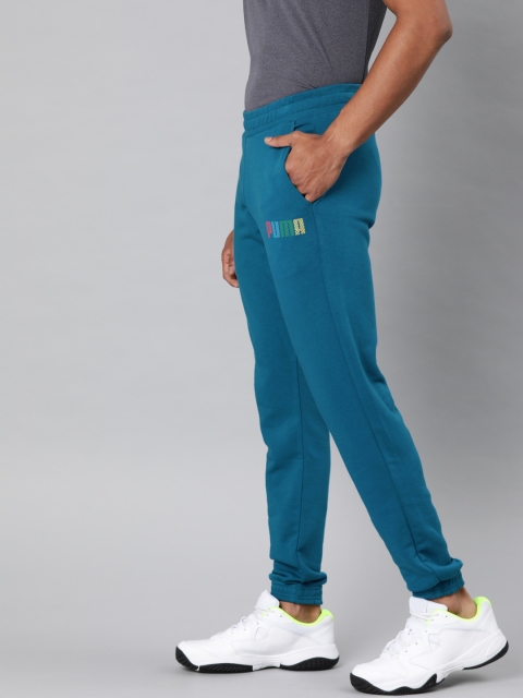 

Puma Men Turquoise Blue Solid Straight Fit Knitted Joggers With Printed Detailing