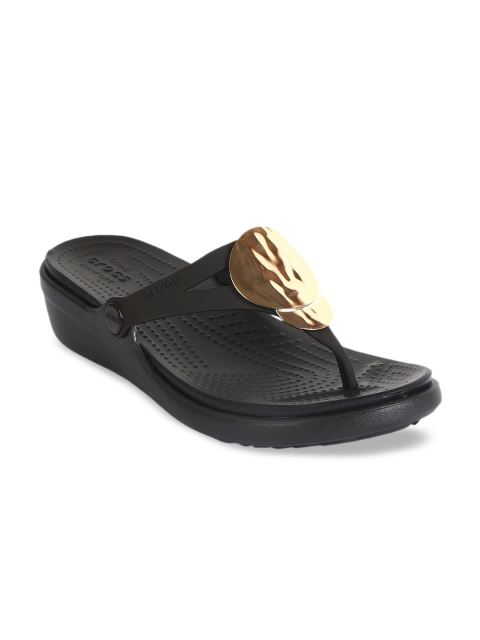 

Crocs Women Black Solid Wedge Heels with Embellishments