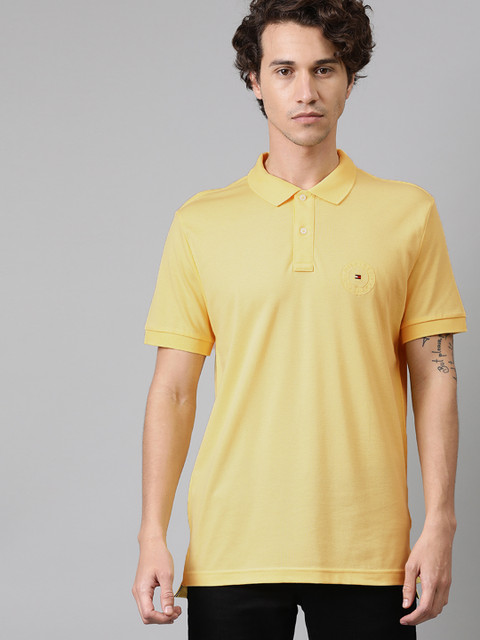 

Tommy Hilfiger Men Yellow Solid Polo Collar Pure Cotton T-shirt With Embroidered Detailing